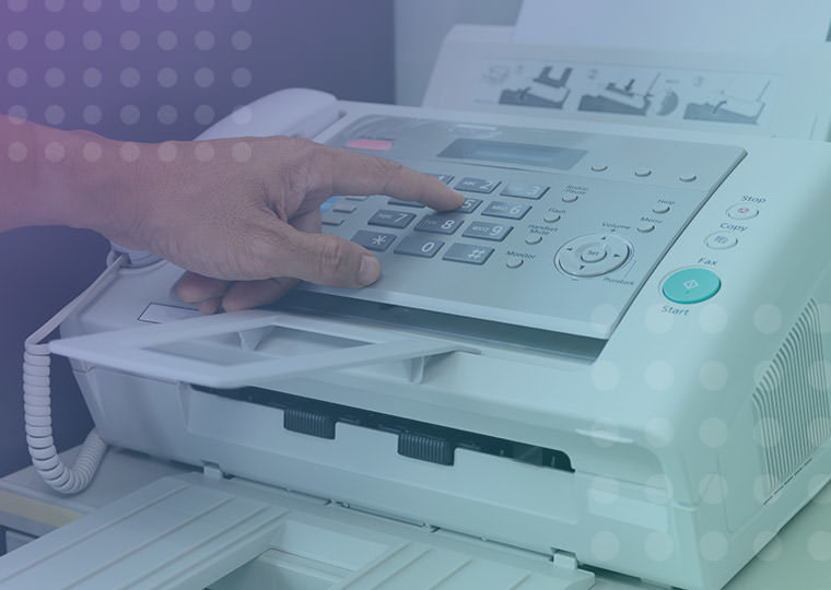 Fax machine being used with male typing on number entry pad